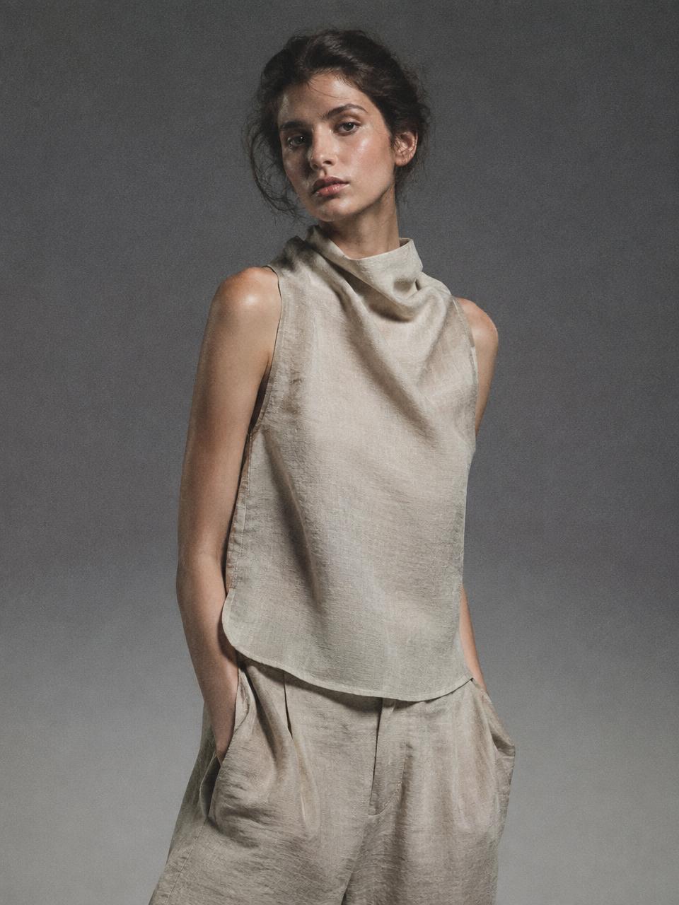 Model in raw linen top and trousers